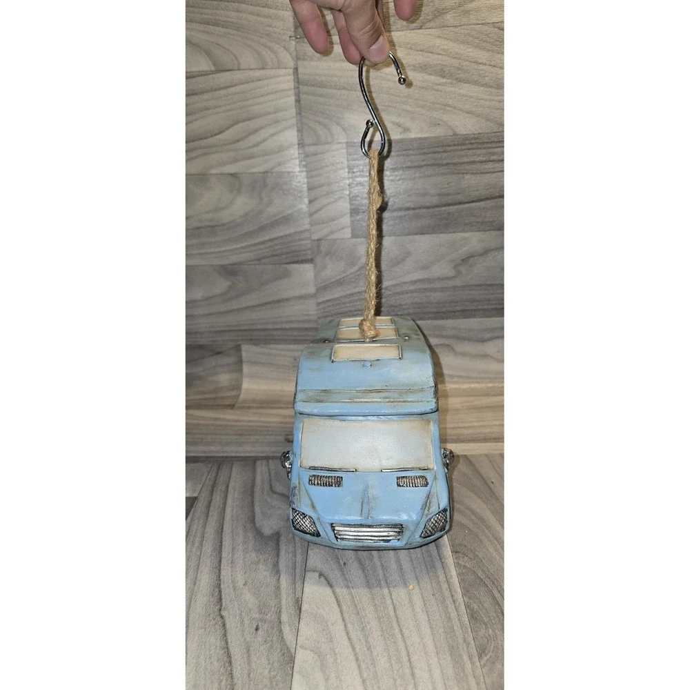 decorative birdhouse designed to look like a retro RV camper van